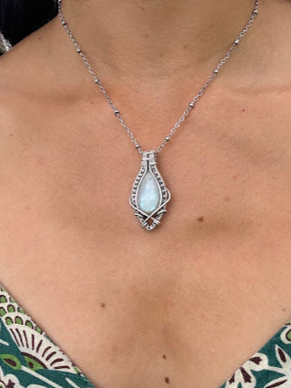 Aurora's Embrace - Rainbow Moonstone Sterling Silver Wire Wrapped Pendant